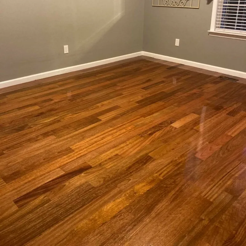 Amber hardwood floor in a gray-walled room with a satin finish